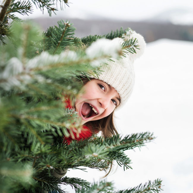 A small girl having fun in snow.